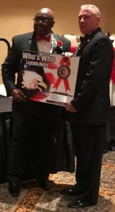 Michael Munyon receive Who's Who Plaque