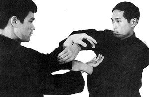 Ted Wong conducts “sticking hands” practice with Bruce Lee