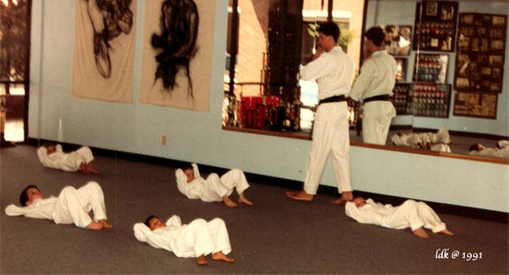 Sensei Mitch Coslet martial arts class doing situps.