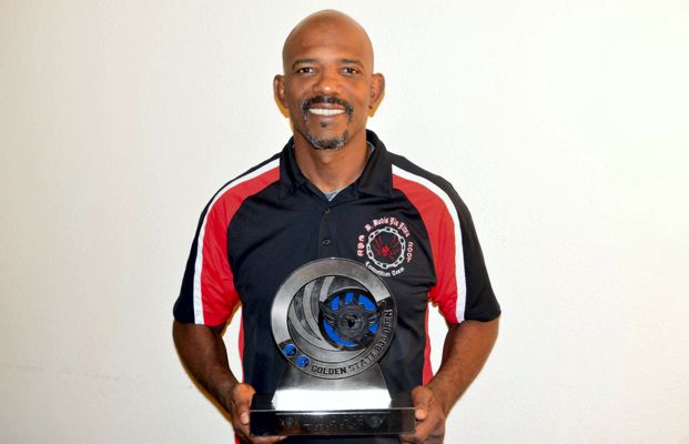 Primal Jiu Jitsu Training  Center San Diego owner D. Davis holds trophy from the Golden State BJJ Open.
